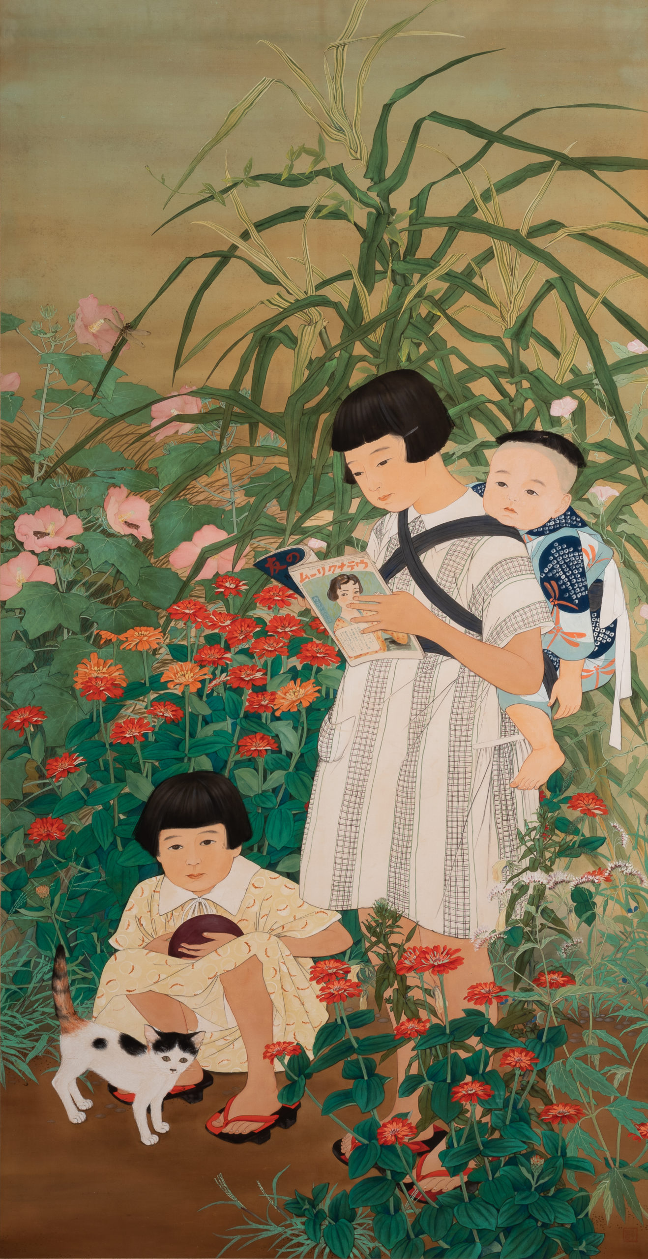 a young girl playing with a cat crouches in among flower bushes and greenery while another girl stands with a baby on her back