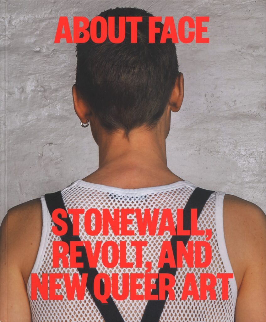 Cover of book: Back view of a person, earring in left ear, wearing a white mesh tank with black suspenders.