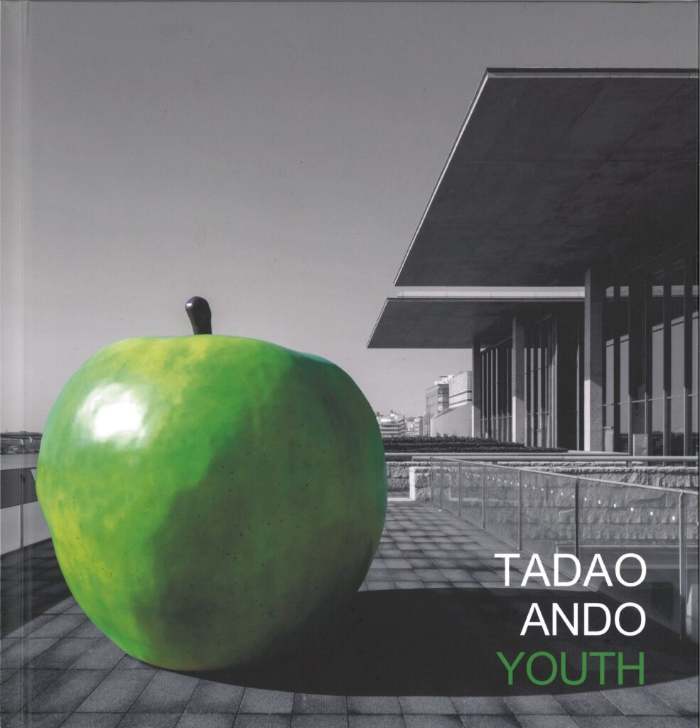cover of book, Tadao Ando Youth, image of a green apple in the foreground with a building to the right and in the background